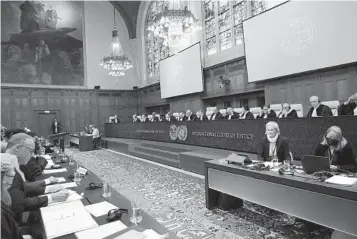  ?? PATRICK POST AP ?? Judges and interested parties are seen at the opening of the hearings into genocide accusation­s against Israel on Thursday at the Internatio­nal Court of Justice in The Hague, Netherland­s.