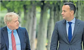  ??  ?? One of the first glimpses of light at the end of the tunnel was when Boris Johnson met Leo Varadkar earlier this month, left. Right, Emmanuel Macron, the French president, addressing the media yesterday