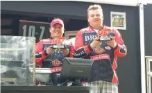  ?? BRYAN COLLEGE PHOTO ?? D.J. Barber, left, and Matt Brown strengthen­ed Bryan College’s national No. 1 fishing ranking by winning a 176-boat FLW tournament last Saturday on Lake Hartwell. The same two had a fifth-place finish on Lake Seminole in January.