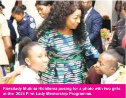  ?? ?? Fierstlady Mutinta Hichilema posing for a photo with two girls at the 2024 First Lady Mentorship Programme.