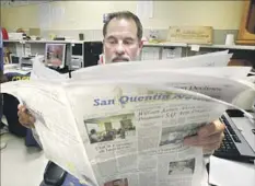  ?? Mark Boster Los Angeles Times ?? ARNULFO GARCIA, the former editor in chief of the San Quentin News, reads the latest edition produced by inmates in December 2013.