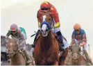  ?? DENNIS SCHNEIDLER/USA TODAY SPORTS ?? Justify became horse racing’s 13th Triple Crown champ by winning the 150th Belmont Stakes on Saturday.