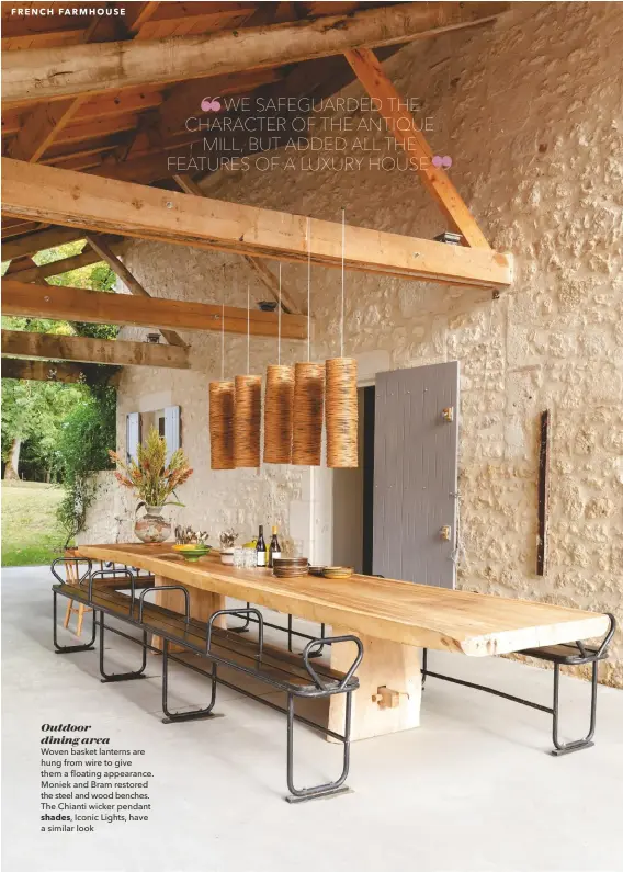  ??  ?? Outdoor dining area
Woven basket lanterns are hung from wire to give them a floating appearance. Moniek and Bram restored the steel and wood benches. The Chianti wicker pendant
shades, Iconic Lights, have a similar look