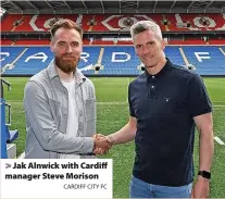  ?? CARDIFF CITY FC ?? > Jak Alnwick with Cardiff manager Steve Morison