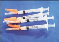  ?? Rogelio V. Solis / Associated Press ?? Syringes loaded with adult doses of Pfizer's COVID-19 vaccine lie ready for use in Jackson, Miss., on Sept. 21.