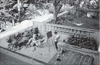  ?? COURTESY THE STONINGTON HISTORICAL SOCIETY ?? “William and Robert Stuckey in rock garden behind 145 Water Street, 1968” by Rollie McKenna from the new “Village Love Affair” exhibition at Woolworth Library &amp; Research Center.