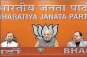  ?? SANCHIT KHANNA/HT PHOTO ?? ▪ BJP president Amit Shah and other party leaders during a press conference after the Rafale deal judgment by the Supreme Court, at the BJP headquarte­rs in New Delhi on Friday.