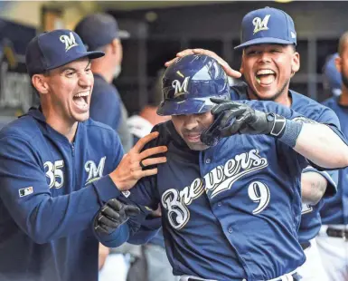  ?? BENNY SIEU / USA TODAY SPORTS ?? Celebratin­g the way the Brewers typically have won’t be possible under the regulation­s baseball will have in 2020 to slow the spread of coronaviru­s.