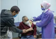  ?? AP ?? A man receives the AstraZenec­a COVID-19 vaccine at Al-Nozha Hospital in Cairo on Thursday.