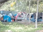  ?? ?? Tents are set up at a homeless encampment at Lee Gerner Park on Tuesday.