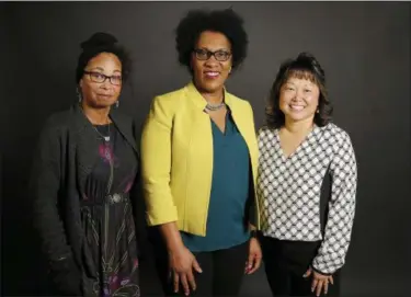  ?? SAM GREENE — THE CINCINNATI ENQUIRER VIA AP ?? From left, Tanisha Agee-Bell, Mina Jefferson and Susan Stockman pose in the Enquirer Studio in downtown Cincinnati on Thursday. The three women are mothers to sons who have recently been the victims of racist behavior.