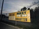  ?? Caleb Santiago Alvarado/The Guardian ?? A banner honouring Michael ‘Mikey’ Schuls at the homecoming bonfire at Florence high school in September. Photograph: