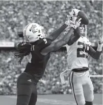  ?? THJE ASSOCIATED PRESS ?? LSU cornerback Andraez Williams, right, deflects a pass intended for UTCwide receiver Alphonso Stewart during Saturday’s game in Baton Rouge, La.,