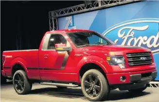  ?? Photos: Ford ?? Not for the timorous, the new 365-h.p., twin-turbo, V-6-powered Ford F150 Tremor features an appearance package with flat black accents, 20-inch wheels, body side graphics and black leather buckets inside.