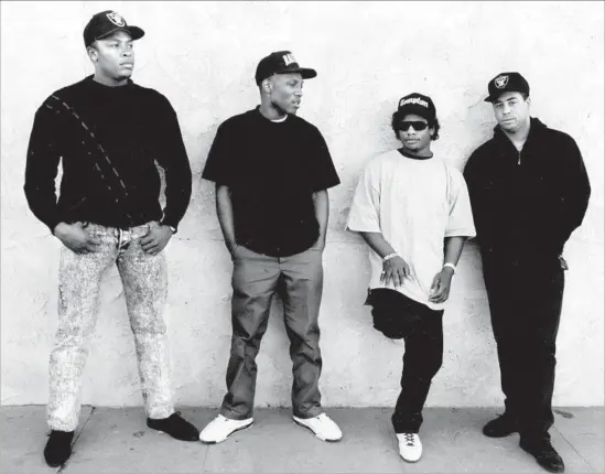  ?? Tony Barnard Los Angeles Times ?? N.W.A MEMBERS Dr. Dre, from left, MC Ren, Eazy-E and DJ Yella are shown in Los Angeles in January 1990. Ice Cube left the band in 1989 over a royalty dispute.