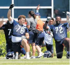  ?? JOSE M. OSORIO / CHICAGO TRIBUNE ?? Bears rookie offensive lineman Teven Jenkins (76) and other players work out during minicamp on June 17 at Halas Hall in Lake Forest.