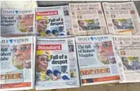  ?? AFPPIX ?? A photo taken in the Kenyan city of Nairobi yesterday shows local dailies with headlines about the situation in Zimbabwe.