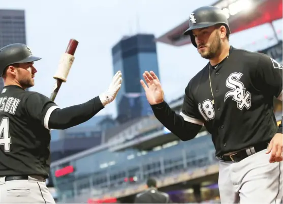  ?? JIM MONE/AP ?? Matt Davidson (left) congratula­tes Daniel Palka after Palka scored on a single by Omar Narvaez off Twins pitcher Kyle Gibson in the first inning Saturday.