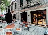  ??  ?? The SmokeShack burger (left). Shake Shack chooses Xintiandi for its first Chinese mainland venture. — Courtesy of Shake Shack