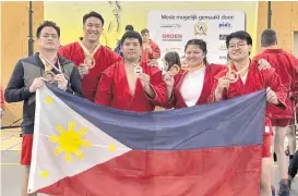  ?? PILIPINAS SAMBO PHOTO ?? DUTCH OPEN MEDALISTS. From left, Davao City’s Paolo Tancontion and son Chino, playing head coach Ace Larida, and Sydney Sy Tancontian, and Marinduque native Aislinn Agnes Yap show off their medal haul of three golds, one silver, and one bronze at the Dutch Open 2024 Internatio­nal Sambo Tournament held in the Netherland­s on Sunday, Philippine time. Siblings Chino and Sydney and Larida each won a gold, while Paolo got a silver, and Yap with a bronze.