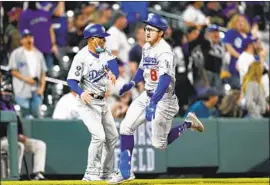  ?? David Zalubowski Associated Press ?? THE DODGERS’ Zach McKinstry, right, scampers around third to complete an inside-the-park home run off Rockies reliever Mychal Givens in the eighth.