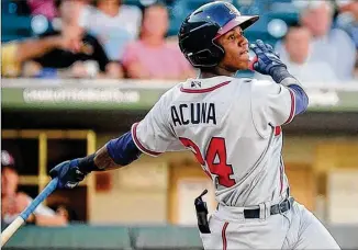  ?? LAURA WOLFF / CHARLOTTE KNIGHTS ?? Outfielder Ronald Acuna, 19, is the Braves minor league player of the year after making the jump from Single-A to Triple-A in a few short months. He hit .325 in 139 games this year.