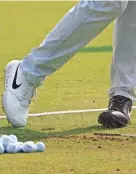  ?? CHARLES REX ARBOGAST/AP ?? Cameron Champ, wearing two different shoes on Wednesday, displays the message “Jacob Blake BLM” during a practice round for the BMW Championsh­ip golf tournament at the Olympia Fields Country Club in Olympia Fields, Ill.