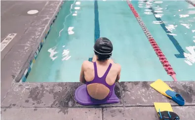  ?? RICK BOWMER/AP ?? A proposed ban on transgende­r athletes playing girls school sports in Utah would affect transgende­r girls like this 12-year-old swimmer. She cried when she heard about the legislativ­e proposal, which would separate her from her friends.