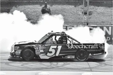  ?? Associated Press ?? ■ Kyle Busch celebrates with a burnout after winning a NASCAR Truck Series auto race Saturday in Long Pond, Pa.