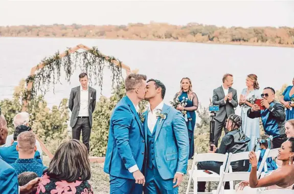  ?? Photos by Heather Glenn / Elysian Bloom Photograph­y ?? The groom and groom exchanged vows Oct. 2 in front of 125 guests at the Filter Building on White Rock Lake in Dallas.