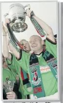  ??  ?? Glory days: Tim McCann lifts the Irish League with Glens