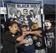  ?? PATRICK TEHAN — STAFF PHOTOGRAPH­ER ?? Lazanne Fajardo, of CordeValle, poses with fellow fans at a tailgate party before Saturday’s exhibtion game against the Los Angeles Rams at the Coliseum.