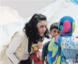  ?? UNITED NATIONS WORLD FOOD PROGRAMME ?? UN food program emergency communicat­ions officer and author Marwa Awad at work in the field. Helping displaced people before they become refugees makes economic and social sense.