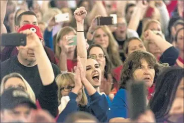  ?? Craig Hudson Charleston Gazette-Mail ?? TEACHERS and their supporters celebrate after a deal was reached in Charleston, W.Va. “What a good day,” Gov. Jim Justice said. Many teachers said soaring healthcare costs were behind their decision to go on strike.