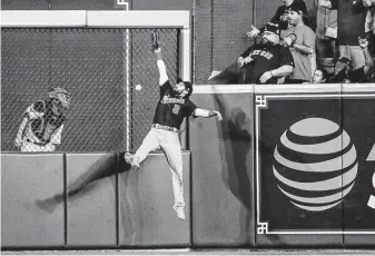  ?? Brett Coomer / Staff photograph­er ?? Nationals right fielder Adam Eaton just misses catching a ball hit by the Astros’ George Springer that went for a double and drove in Kyle Tucker during the eighth inning.