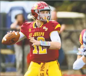  ?? Christian Abraham / Hearst Connecticu­t Media ?? St. Joseph QB David Summers prepares to throw a pass against Darien on Saturday in Trumbull.