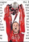  ??  ?? Falling value: Jordan Henderson on with the Premier League trophy hy