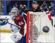  ?? MIKE CARLSON — GETTY IMAGES ?? The Avalanche’s Justus Annunen looks for the puck against the Lightning on Thursday at the Amalie Arena in Tampa, Fla.