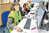  ??  ?? Volunteer army: Veronica Hendry works to ensure food is allocated to charities