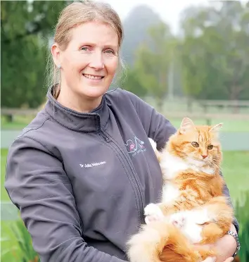  ?? ?? Our Pet Mobile Vet, Dr Julia Malcolm BVSc (Hons) with Findus.