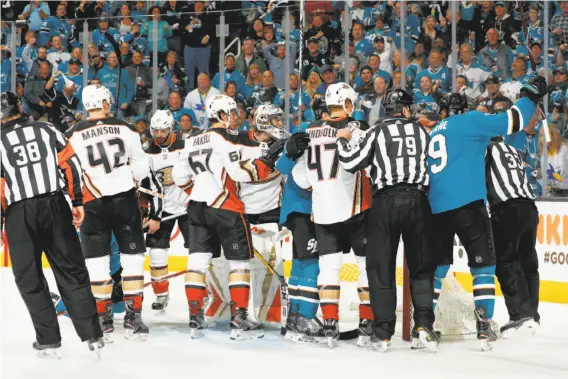  ?? Scott Dinn / NHLI via Getty Images ?? Sharks and Ducks players square off in a series of shoving matches during Game 3 of their first-round Western Conference playoff series at SAP Center.