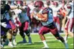  ?? COLGATE ATHLETICS ?? Colgate running back Alex Mathews heads upfield against Holy Cross last season.