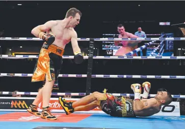  ?? STAND UP GUY: Jeff Horn ( left) knocks out Anthony Mundine in Brisbane. Picture: AAP/ DARREN ENGLAND ??