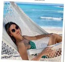  ??  ?? @alessandra­ambrosio hitsthe beachin designersh­ades on hersummer getaway