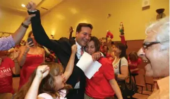  ?? VINCE TALOTTA/TORONTO STAR ?? Marco Mendicino, a Toronto lawyer, celebrates his win in the Liberal nomination race with his family.