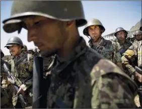  ?? ?? Afghan Army soldiers gather May 8, 2013, at a training facility on the outskirts of Kabul.