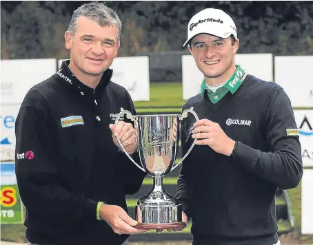  ??  ?? David Law, right, with mentor Paul Lawrie after winning the Lawrie Invitation­al event at Deeside in 2013.