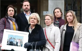  ??  ?? Irene Collins (centre) mother of the late Karl Collins and his siblings at Sligo Courthouse Monday.