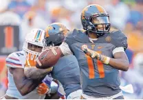  ?? WADE PAYNE/ASSOCIATED PRESS ?? Tennessee’s Joshua Dobbs (11) had a key part in five secondhalf TDs in the Vols’ stunning win over Florida on Saturday.