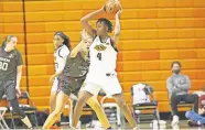  ??  ?? Natasha Mack (4) had 26 points, 18 rebounds, five assists and five blocked shots — the latter giving her 176 career blocks at OSU to become the school's all-time leader.